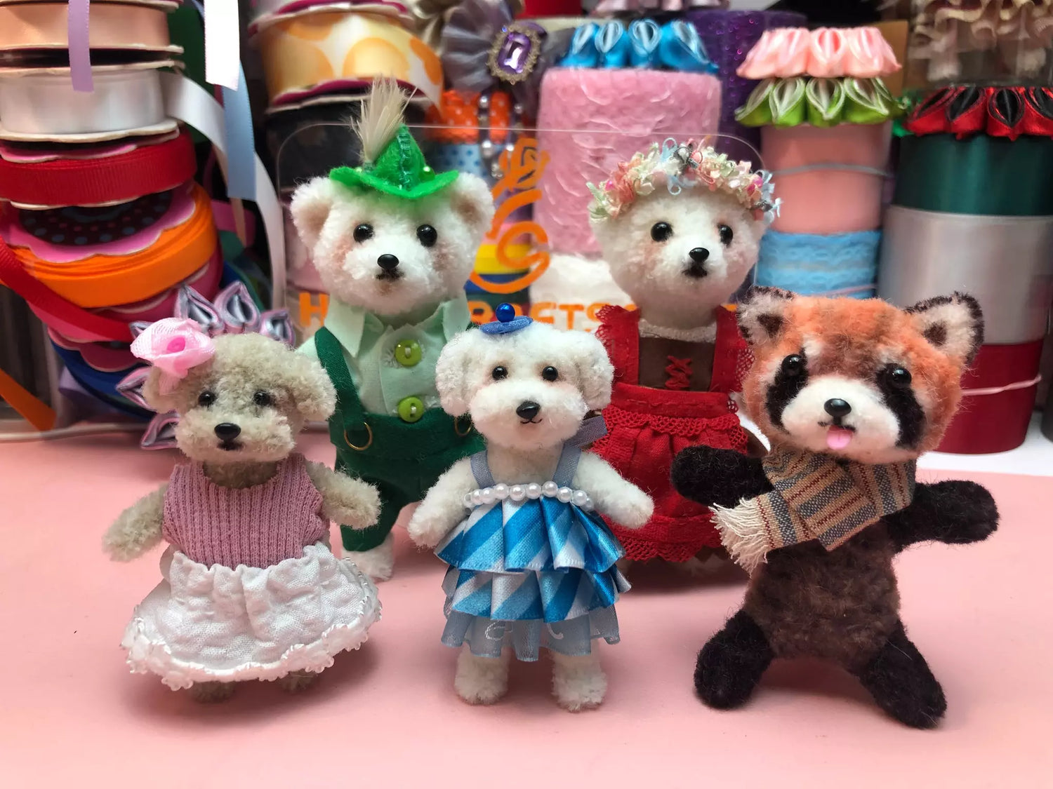 Charming wool twisted stick animal creations: handcrafted puppies, raccoon, bear figurines. Unique animal art.