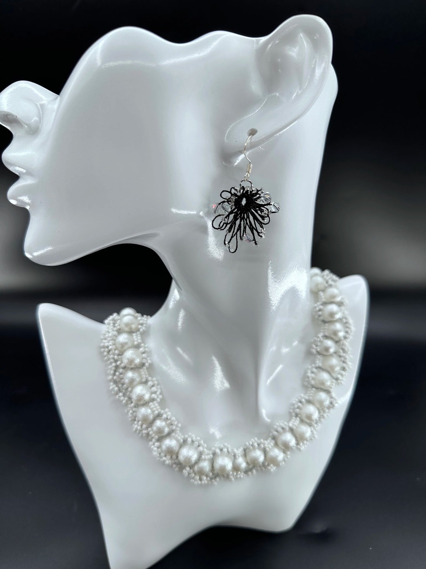 Phoenix Flower tatting earrings with crystal beads, handcrafted in black, elegantly displayed on a mannequin. Necklace shown is for styling purposes only and sold separately.