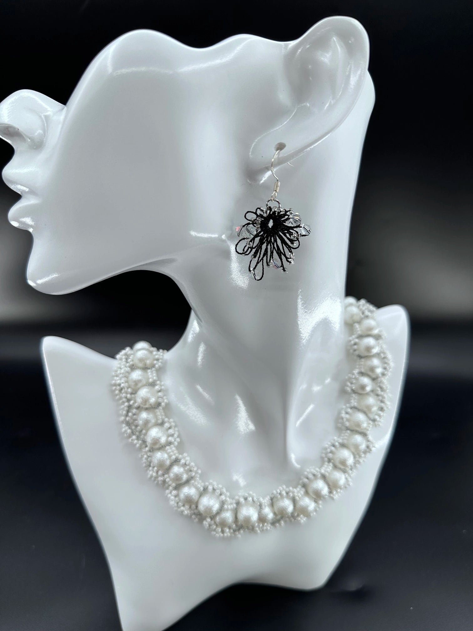 Phoenix Flower tatting earrings with crystal beads, handcrafted in black, elegantly displayed on a mannequin. Necklace shown is for styling purposes only and sold separately.