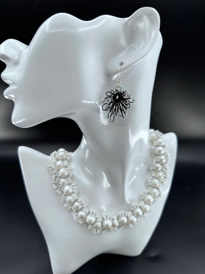 Phoenix Flower tatting earrings with crystal beads, handcrafted in black, elegantly displayed on a mannequin. Necklace shown is for styling purposes only and sold separately.