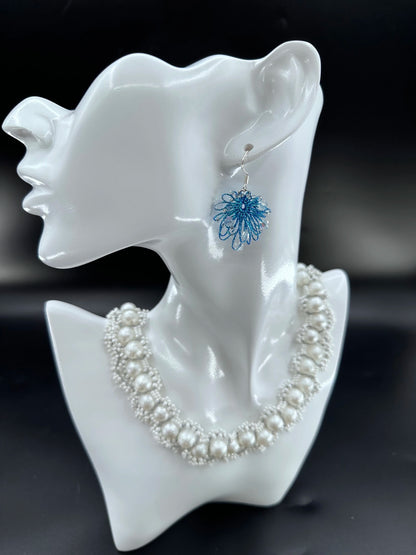 Phoenix Flower tatting earrings with crystal beads, handcrafted in blue, elegantly displayed on a mannequin. Necklace shown is for styling purposes only and sold separately.