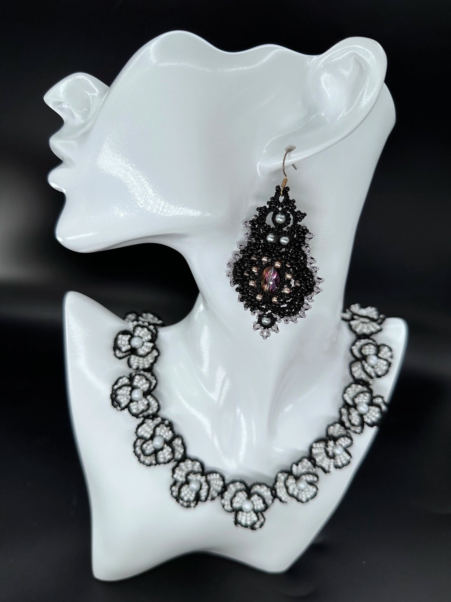 Chic Corelight dangle earring in classic black, with subtle black **tatted** threadwork meticulously crafted around shimmering glass bead clusters, offering a modern handmade elegance