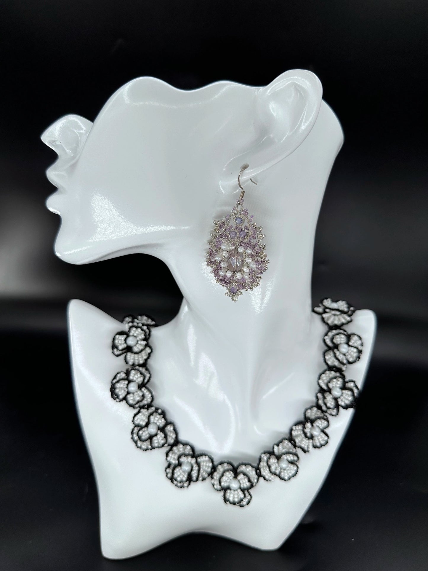 Sophisticated Corelight oval earring in enchanting purple-white, highlighted by intricate silver **shuttle tatting** artistry and sparkling glass bead arrangements, handmade for unique style