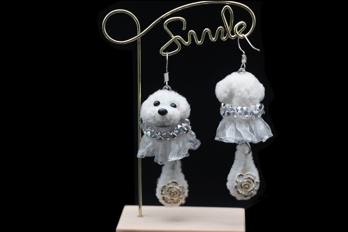 Handcrafted white wool twisted stick puppy earrings with silver lace skirts, showing front and back details.