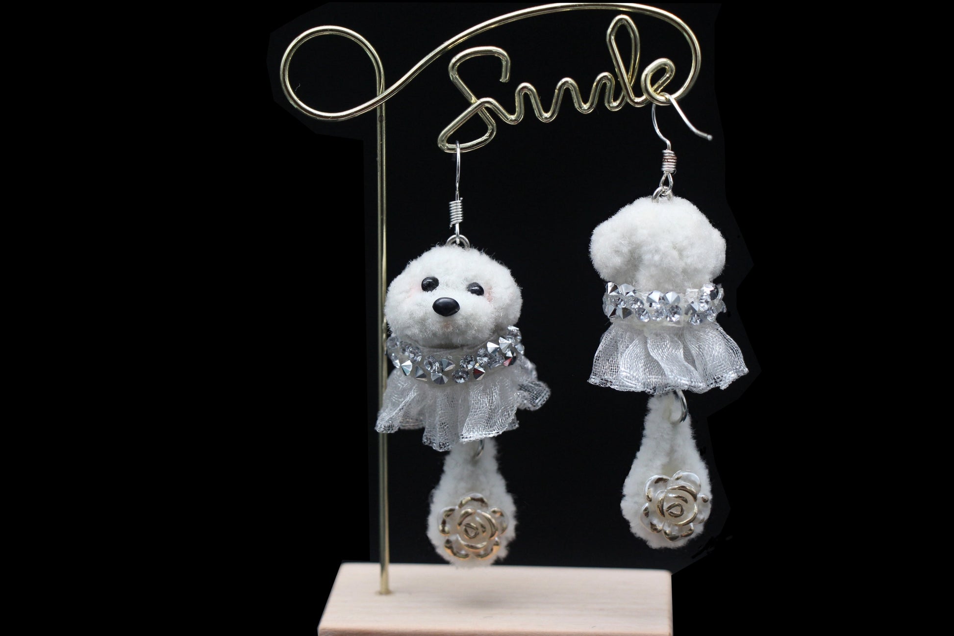 Handcrafted white wool twisted stick puppy earrings with silver lace skirts, showing front and back details.