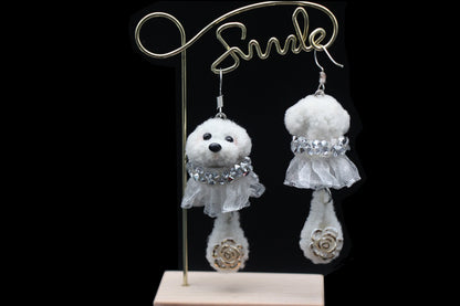 Handcrafted white wool twisted stick puppy earrings with silver lace skirts, showing front and back details.