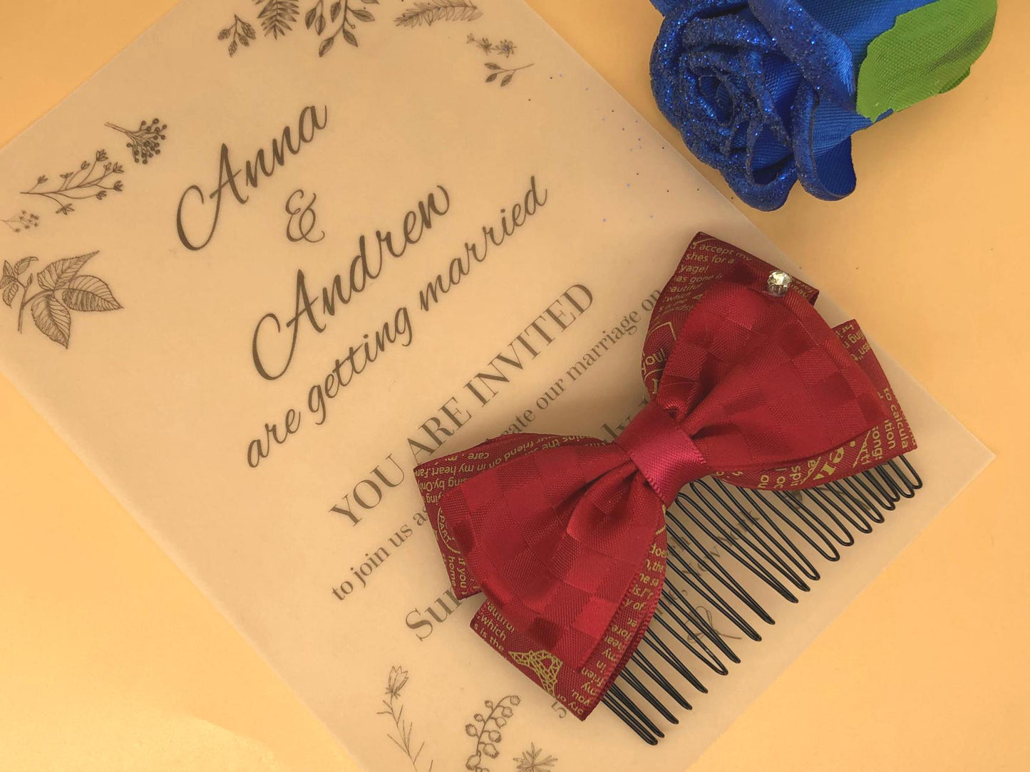 Red plaid ribbon bow over text ribbon claw clip with small rhinestone.